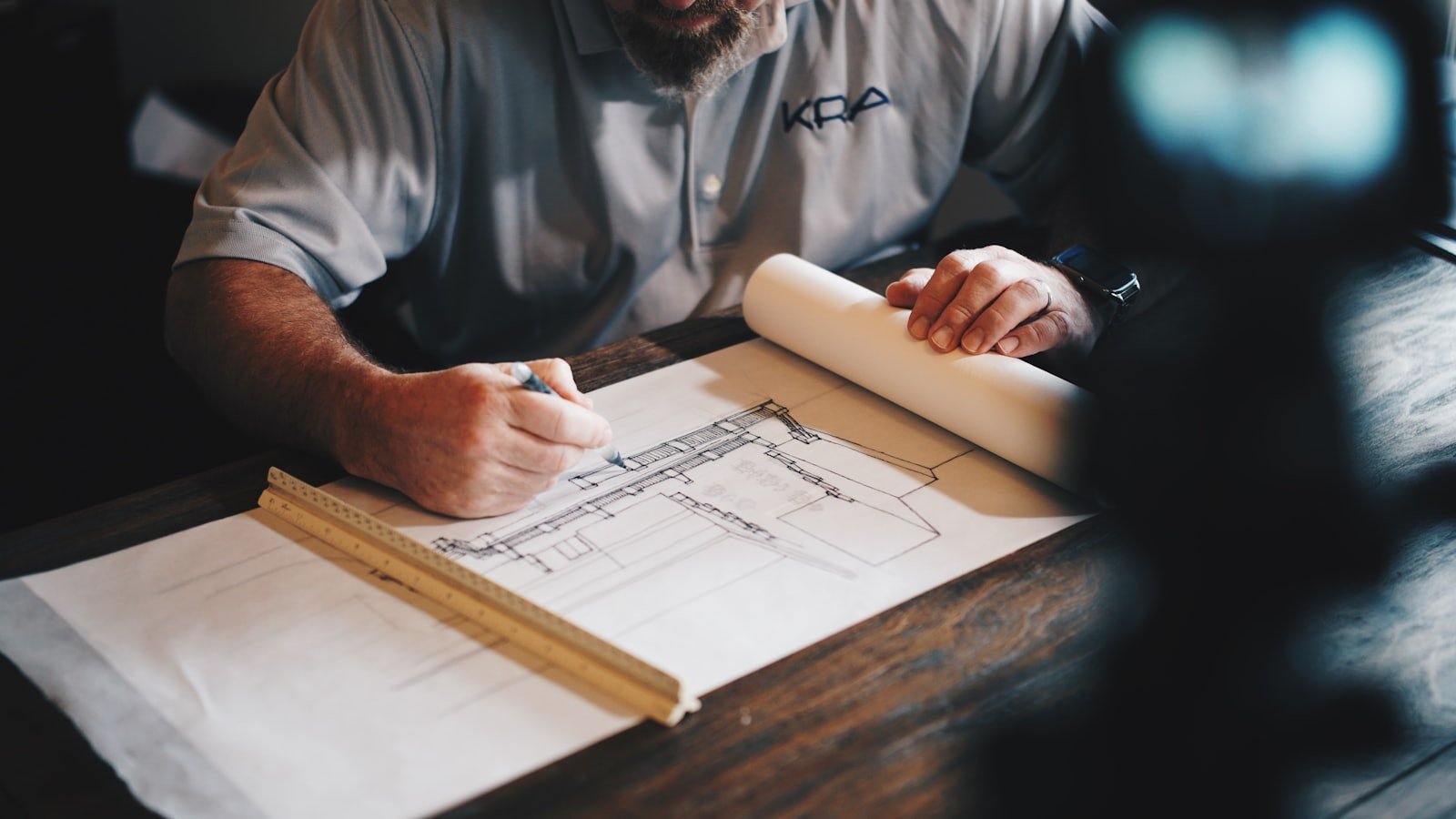 Project team reviewing construction drawings during preconstruction planning
