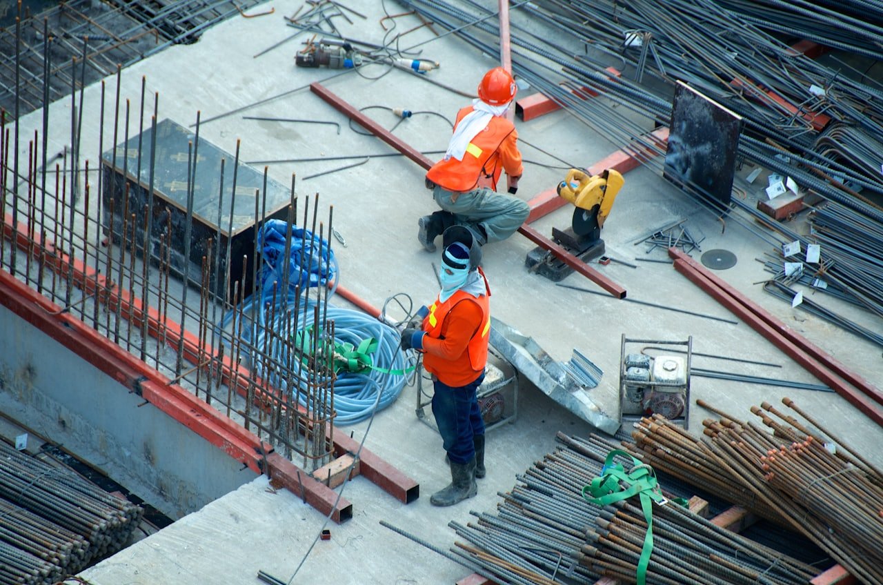 Construction crew coordinating work on an active site